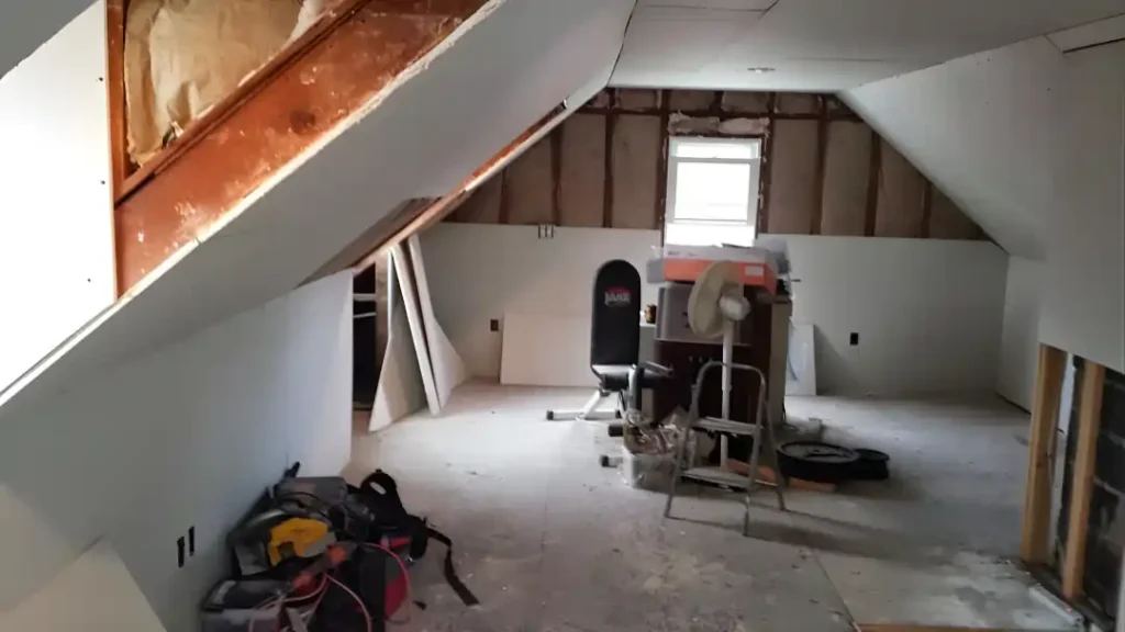 MSD Contractors - Attic room remodel with drywall installation in progress and framing
