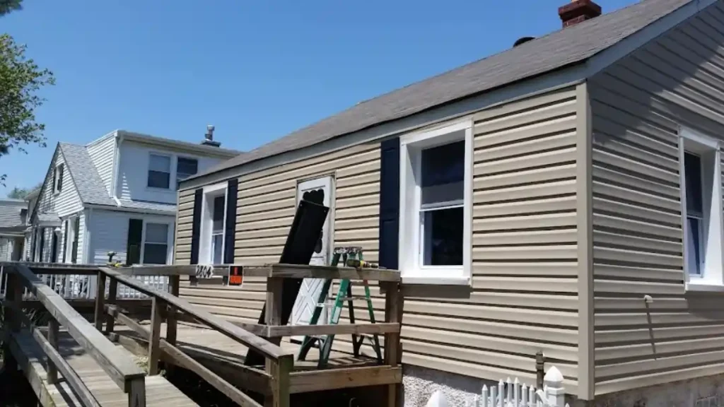 MSD Contractors - Exterior remodel with siding and windows installation in progress