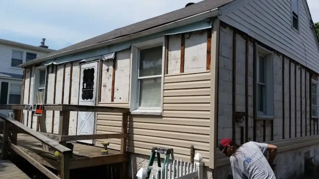 MSD Contractors - Siding installation in progress with contractor and ramp view