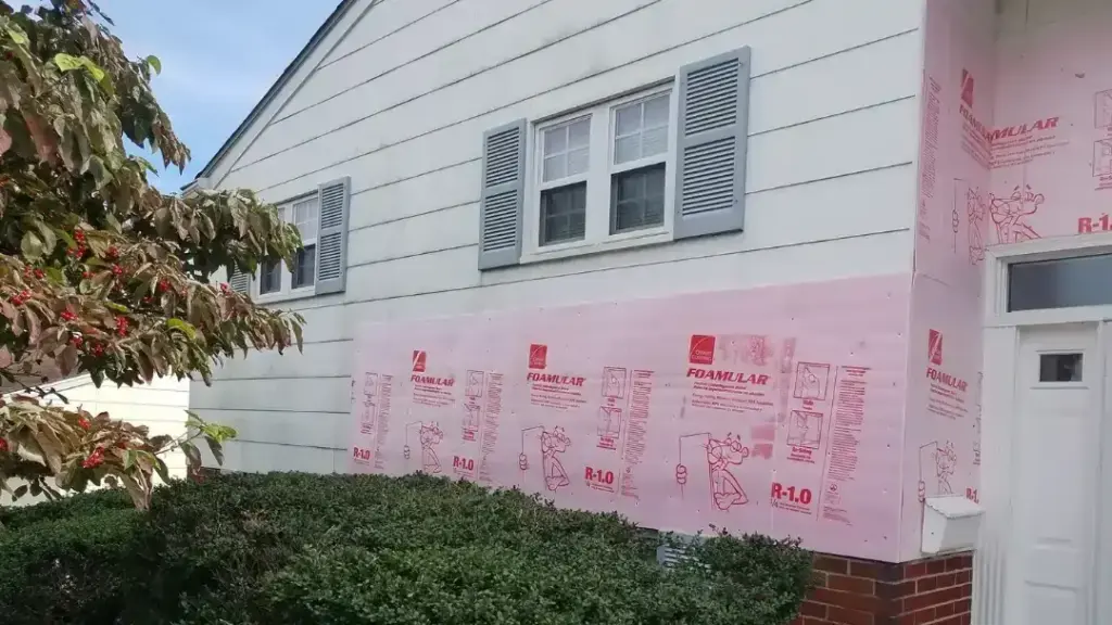 MSD Contractors – Installing foam insulation over brick for siding prep
