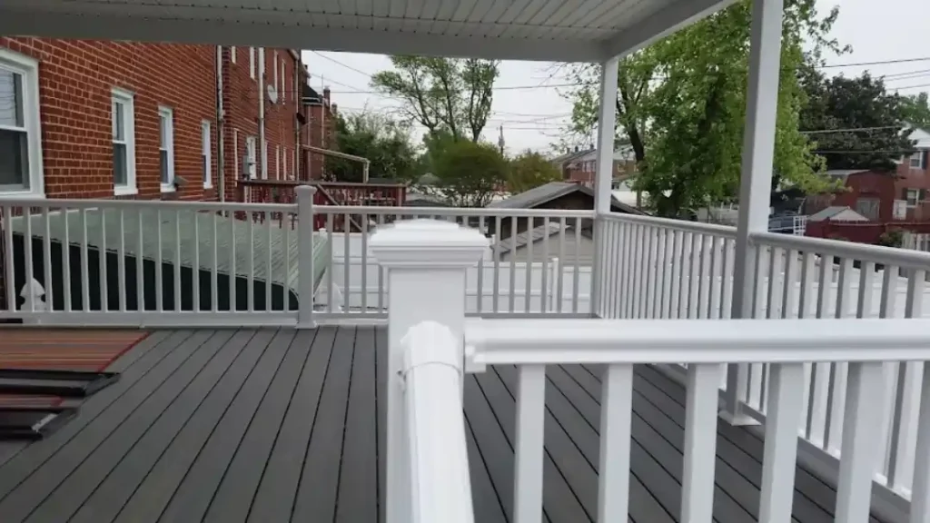 MSD Contractors - Residential deck and balcony with covered roof and white railing